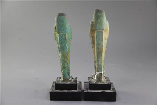 Two Egyptian green glazed composition Shabti, late period, 26th-30th dynasty, circa 664-332 B.C., 18.5 and 19cm excluding ebonised wood